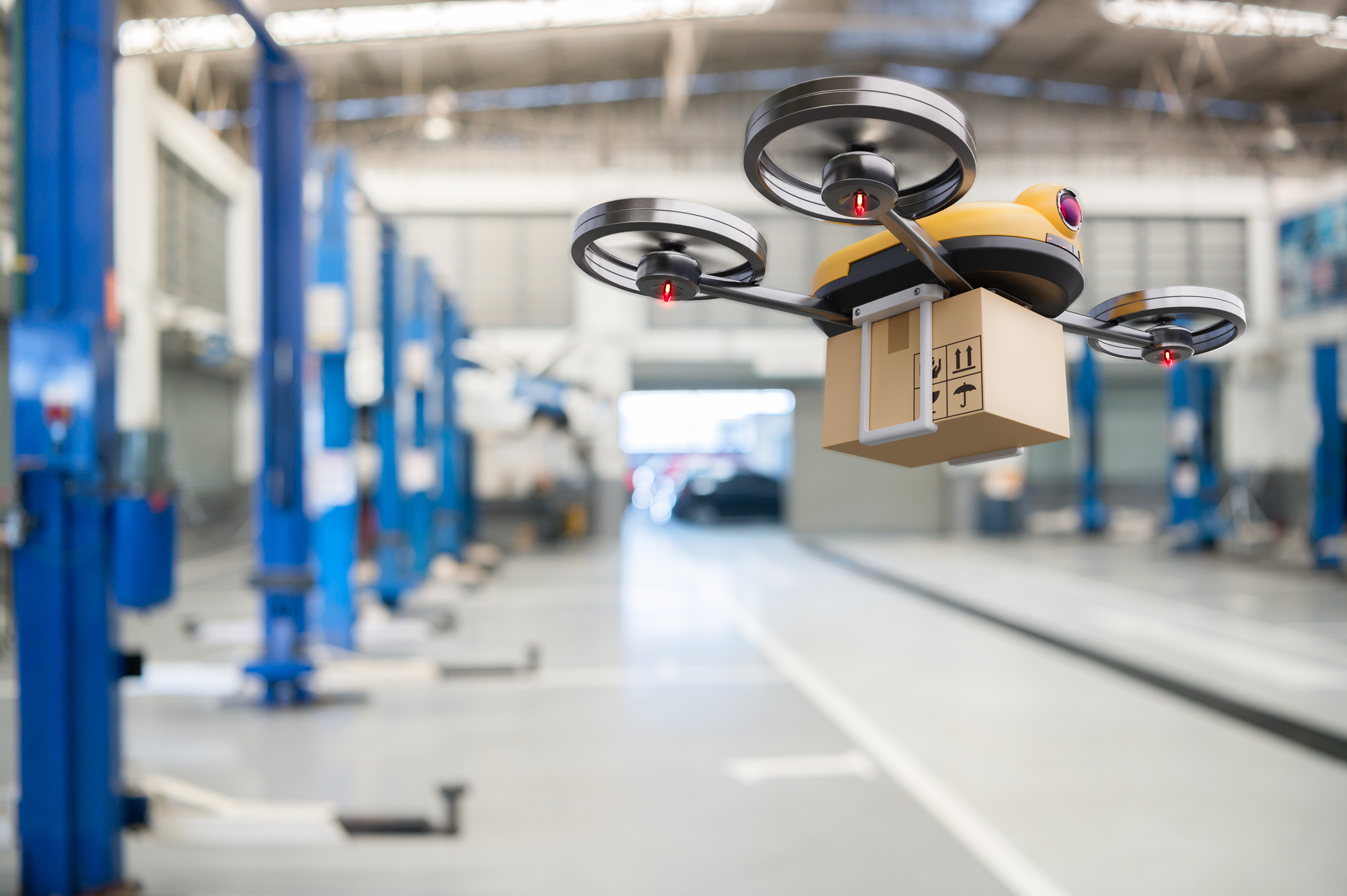 Spare part delivery drone at garage storage in leading automotive car service center for delivering mechanical shipping component part assembling to customer. Modern innovative technology and gadget